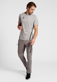 Hummel CIMA XK PANTS - Jogginghose - grey melange
