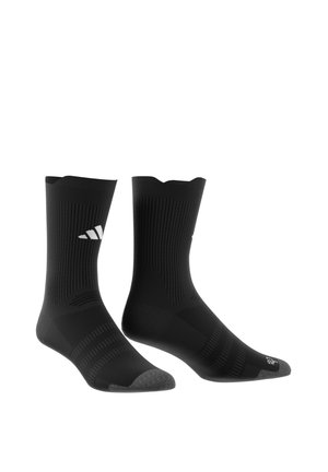 Paire de chaussettes de sport noires mi-mollet avec embouts gris et logo de la marque blanc sur les côtés, présentées debout sur fond blanc.