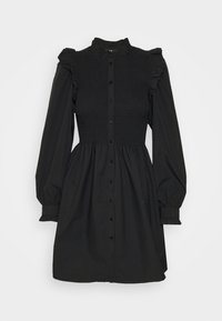 Rochie neagră cu un corset plisat, mâneci lungi voluminoase, decolteu cu volane și închidere cu nasturi pe față. Material moale, texturat.