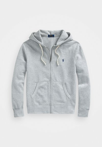Sweatshirt cinza claro com fecho éclair, bolsos frontais, cordões brancos e pequeno logótipo azul marinho da Polo Ralph Lauren no lado esquerdo do peito.