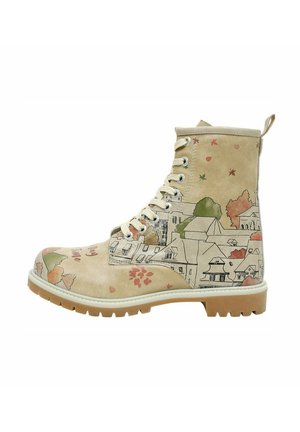 Beige ankle boot with a patterned design featuring houses and trees, textured suede upper, round toe, and white rubber sole with a brown tread.