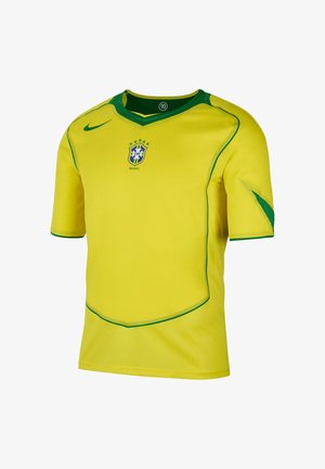 Gul kortærmet fodboldtrøje med grønne detaljer, der har et Brasilien nationalhold logo på brystet og en rund halsudskæring.