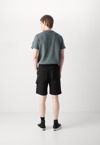 Calvin Klein Jeans CITY GRID  - Pantalones deportivos - black