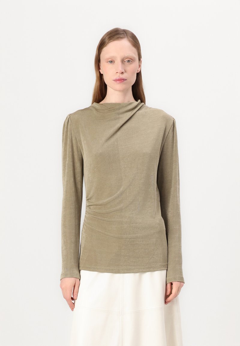 Olive green long-sleeve shirt in draped fabric with a high neckline and gathered detailing at the shoulders, smooth texture, and fitted design.