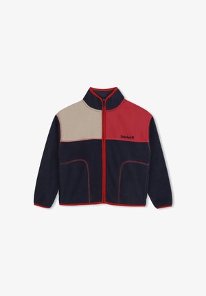 Veste en polaire avec fermeture zippée intégrale sur le devant, en color-block bleu marine, rouge et beige, avec bordure rouge et logo Timberland sur la poitrine.