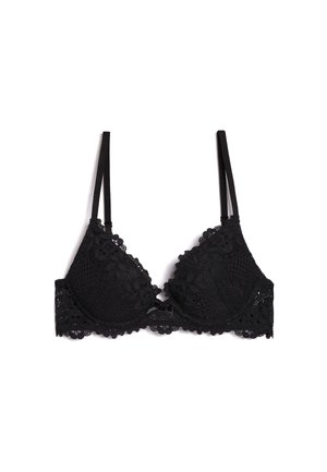 Reggiseno in pizzo nero con coppe imbottite, motivo floreale, spalline regolabili e un piccolo fiocco al centro davanti. Tessuto morbido al tatto.