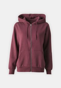 Felpa con zip color bordeaux realizzata in tessuto morbido, con cappuccio regolabile, tasche frontalI e polsini e orlo a coste.