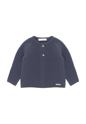 Cárdigan de punto en color marino con mangas raglán, dos botones de madera, patrones de punto texturizados y una pequeña etiqueta decorativa en el dobladillo.