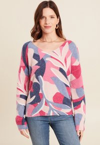 Pull à col en V en tissu doux avec un motif floral multicolore aux nuances de rose, bleu et blanc. Coupe décontractée avec des manches longues.
