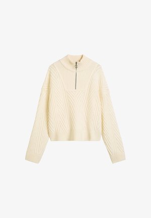 Crème-kleurige cropped sweater met een hoge kraag, voorzien van een halve rits en een visgraatpatroon over de gehele stof. Geribbelde zoom en manchetten.