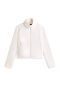 White fleece jacket with a high collar, front zipper, and side pockets. Features small logo on the chest. Soft texture, cropped design.
