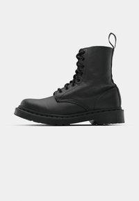 Black leather combat boot with a round toe, lace-up front, and a pull tab at the ankle. Features a thick rubber sole for durability.