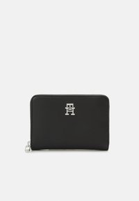 Black leather wallet with a textured finish, featuring a silver logo on the front. It has a zip closure and a compact rectangular shape.