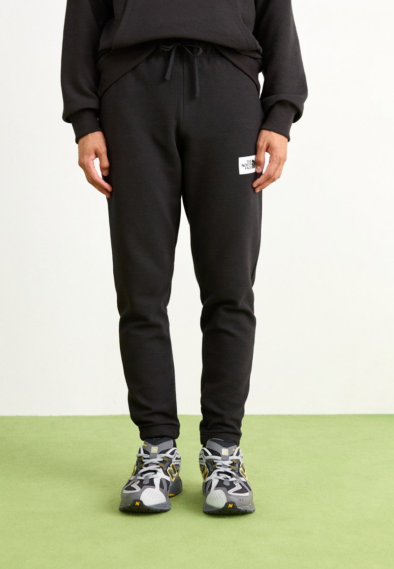 The North Face - Tracksuit bottoms - black, Enlarge