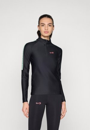 Black long-sleeve athletic top with a half-zip front, textured fabric, teal side accents, and a small pink logo on the chest.