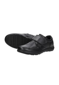Zwarte leren schoenen met een klittenbandsluiting, ronde neus, gevoerde innersoles en een getextureerde rubberen zool voor grip.