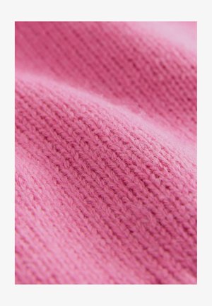Tessuto lavorato a maglia rosa con una texture morbida, che presenta un modello uniforme di punti e una leggera peluria.