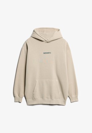 Beżowa bluza z kapturem wykonana z mieszanki bawełny, z przednią kieszenią typu kangur i logo "SUPERDRY" w kolorze zielonym na klatce piersiowej.
