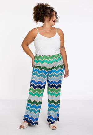 Weite Hose mit Zickzackmuster in Grün, Blau und Beige. Hergestellt aus einem leichten Stoff mit lockerer Passform.