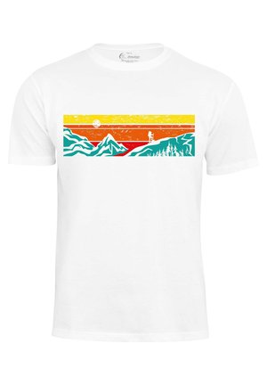 White cotton T-shirt featuring a colorful graphic design: mountains, forest, and sunset in orange, yellow, blue, and red.