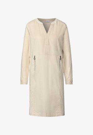 Beige casual jurk met een V-hals, lange mouwen, voorzakken met rits en een soepele, lichte stof. Eenvoudig ontwerp en rechte silhoët.
