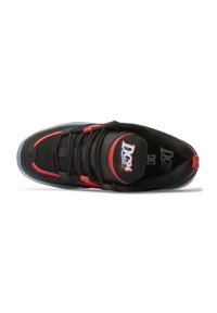 Black and red sneaker featuring a textured mesh upper, padded collar, lace-up design, and rubber sole with a logo on the tongue.