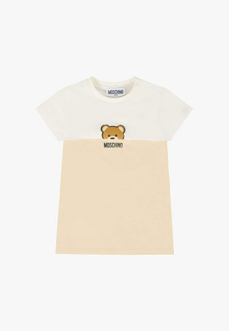 Abito per bambino a maniche corte in bianco e beige con grafica di un orsetto e la scritta "Moschino" stampata sotto nella parte anteriore.