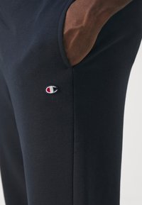 Champion ICONS ELASTIC CUFF PANTS LOOSE FIT - Tepláky - dark blue