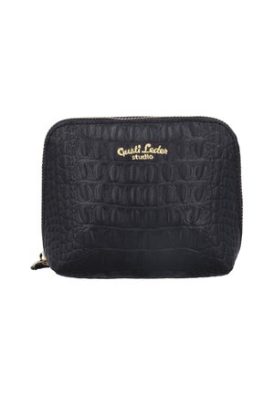 Black crocodile-textured leather wallet with gold zipper and gold "Gusti Leder studio" logo centered at the top front.