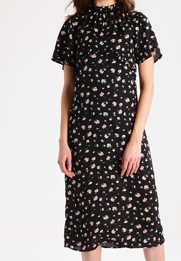 Black floral dress featuring a high neck, short sleeves, and a flowy silhouette with pink and white flower patterns throughout.