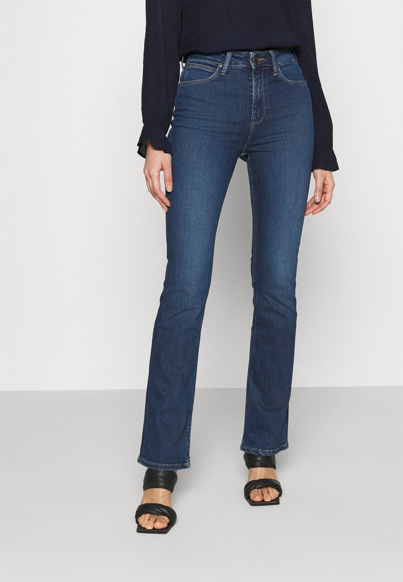 Mörkblå denimjeans med rak bendesign, hög midja, subtila sömmar och en klassisk femficklayout.