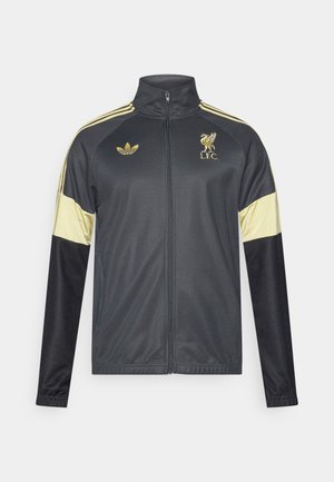 Hall spordijakk kuldsete detailidega, millel on lukk, kõrge krae, õlgadel kolm kuldset triipu ja L.F.C. logo.