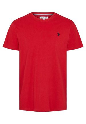 Punane puuvillane T-särk ümarate krae, lühikeste varrukate ja väikese tumesinise logoga vasakul rinnal. Sile tekstuur, lõdva disainiga.