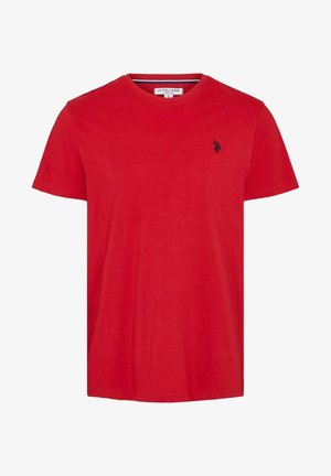 Punane puuvillane T-särk ümarate krae, lühikeste varrukate ja väikese tumesinise logoga vasakul rinnal. Sile tekstuur, lõdva disainiga.
