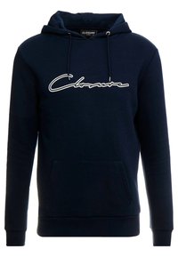 Sudadera navy con cordones, bolsillo frontal y logo en cursiva "Closure" en blanco. Hecha de un tejido suave con puños y dobladillo acanalados.