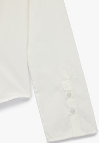 White long sleeve shirt cuff with two buttons and a smooth fabric texture, shown against a plain white background.