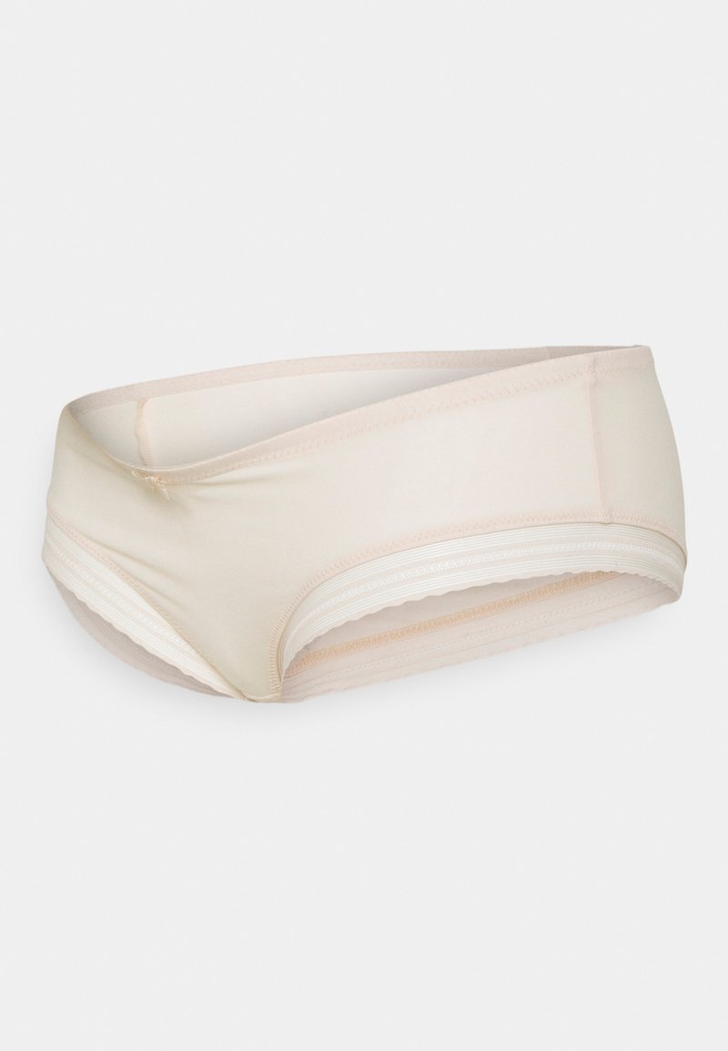 Intimo da donna beige con finitura liscia e design incrociato. Presenta una cintura morbida e un bordo ondulato lungo i lati.