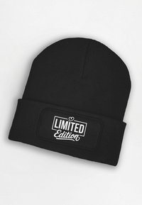 Black knit beanie featuring a white "LIMITED Edition" text patch on the front. The material is ribbed, offering a textured finish.