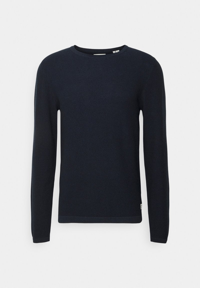 Granatowy sweter z długim rękawem, okrągły dekolt, teksturowany materiał, dopasowany krój, z subtelnym wykończeniem na dole i metką z boku.