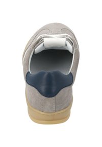 Gray suede sneaker with a navy leather accent, rounded heel, white laces, and a beige rubber sole, featuring a cushioned back for comfort.