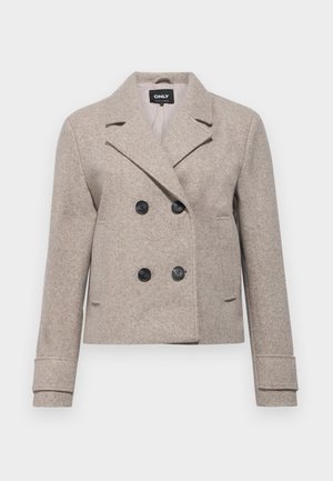 Double-breasted beige cropped jacket with black buttons, notched lapels, and long sleeves, made of textured wool-like material.