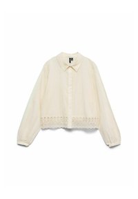 Blouse crème à manches longues, boutonnée sur le devant, col pointu, délicate bordure en dentelle le long de l'ourlet et motifs brodés subtils.