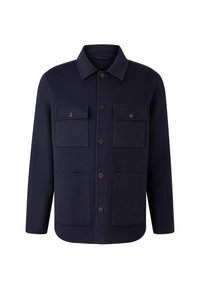 Granatowa wełniana kurtka z kołnierzykiem, czterema przednimi kieszeniami i brązowymi guzikami. Posiada zapięcie na guziki i prosty dół.