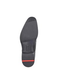Suola di scarpa nera con un motivo testurizzato, caratterizzata da un bordo liscio e una striscia rossa lungo il fondo.