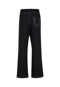 Pantalones de algodón negros con piernas acampanadas, cinturilla elástica y un solo bolsillo trasero con detalles de costura blanca en contraste.