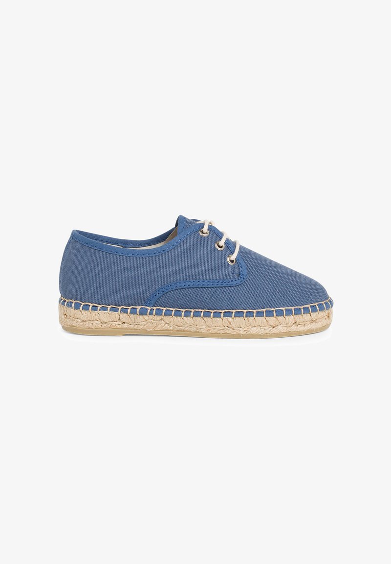 Blue canvas espadrille with a round toe, featuring a woven jute sole and two eyelets with white laces. Smooth texture and lightweight design.