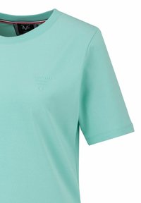 Mintgroene t-shirt met korte mouwen, gemaakt van zachte katoen, met een ronde hals en een reliëflogo op de borst. Gladde textuur.