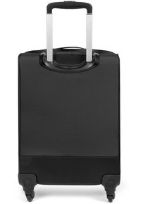 Black hard-shell suitcase with a retractable handle, smooth texture, two small wheels, and a minimalist design. No visible patterns or accents.