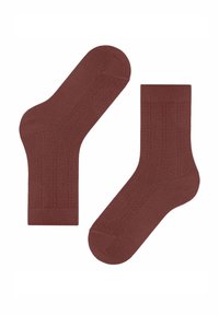 Braune gerippte Socken aus weichem Material, mit einem strukturierten Muster an den Seiten und einer verstärkten Spitze für Langlebigkeit.