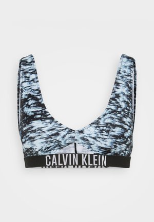 Calvin Klein sports bra in blue and black abstract pattern, featuring a scoop neckline and wide elastic band with logo at the bottom.